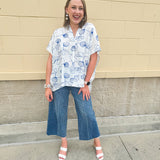 White oversized cotton top with navy seashell embroidery and drop shoulder design