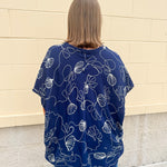 Navy oversized cotton top with cream embroidered seashells and a relaxed silhouette