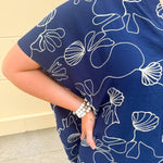 Navy oversized cotton top with cream embroidered seashells and a relaxed silhouette