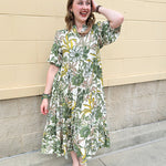 Floral midi dress with green, yellow, pink, and white print and ruffled short sleeves
