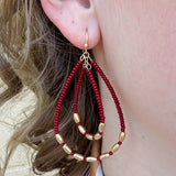Double teardrop beaded earrings with garnet and gold beads, dangle style for fall, holiday, or gameday wear.