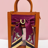 Clear stadium crossbody bag with leather trim and removable FSU scarf accent.