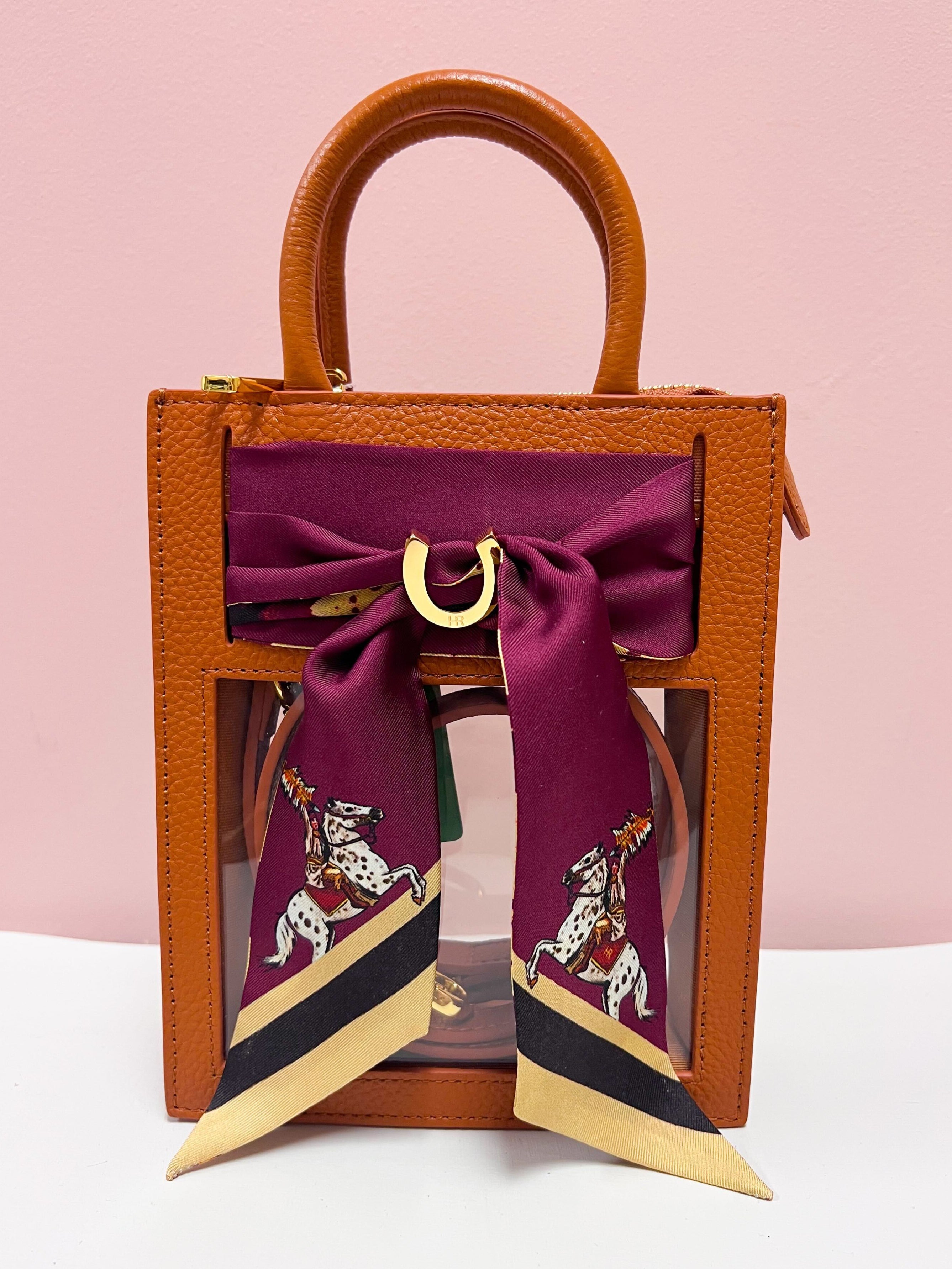 Clear stadium crossbody bag with leather trim and removable FSU scarf accent.