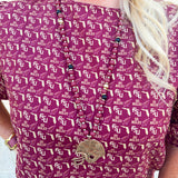 Garnet, black, and gold beaded necklace with a hammered gold football helmet pendant, styled for gameday or seasonal wear.
