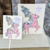 A vibrant hand-painted 8"x10" canvas featuring a stylized Renegade mascot in bright pink, gold, and blue by Caroline Ree Designs.