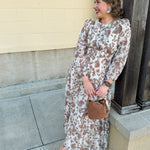 Brown and cream floral midi dress with cinched waist and 3/4 sleeves