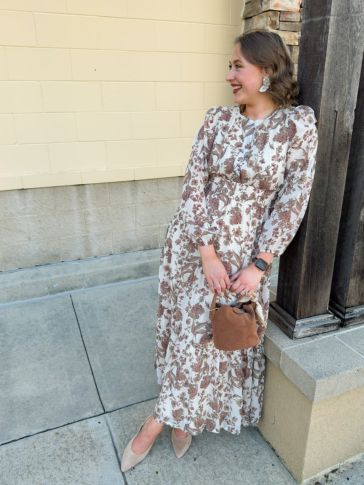 Brown and cream floral midi dress with cinched waist and 3/4 sleeves