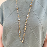 Gold open-link chain necklace with black crystal gemstone accents, 32" length.