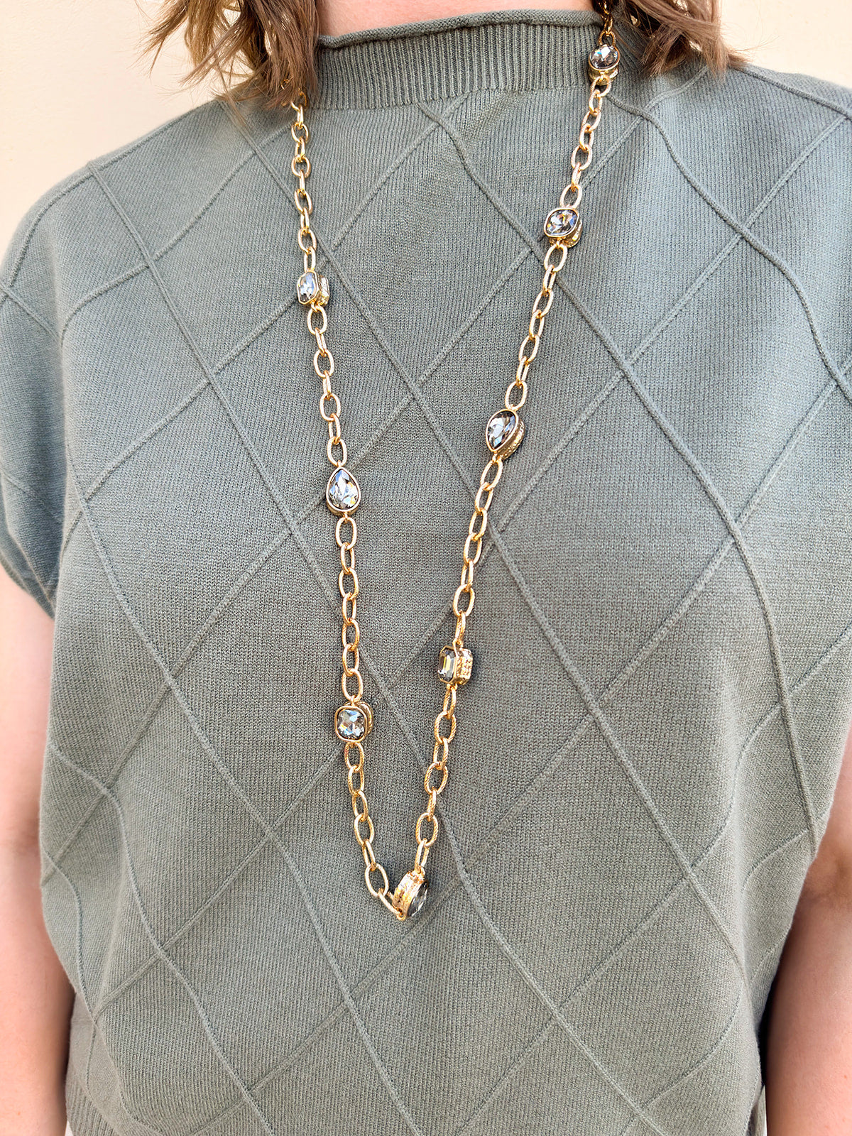 Gold open-link chain necklace with black crystal gemstone accents, 32" length.