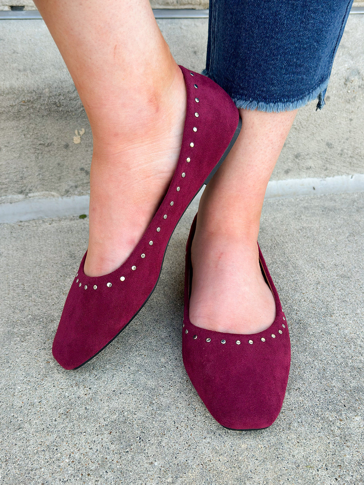 Burgundy flats with silver stud details 