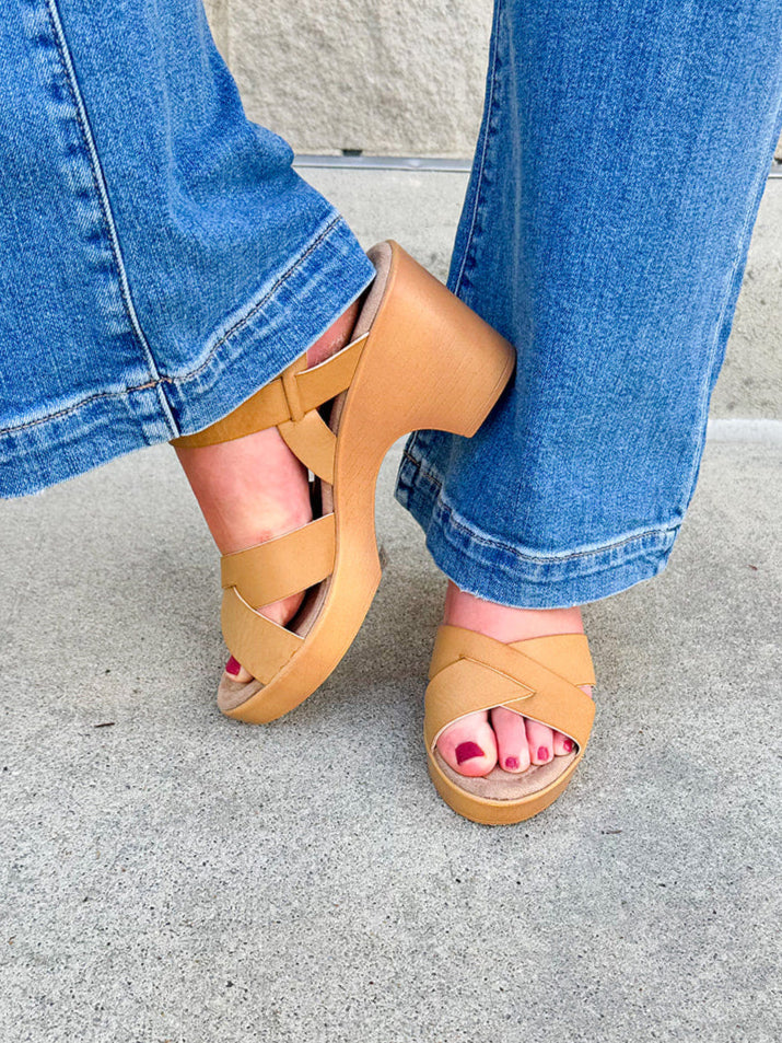 Minimalist open-toe block heel sandal with synthetic upper and adjustable ankle strap—elegant and easy to wear