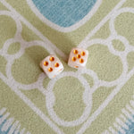 Pair of Duchess Pearlescent Mini Mahjong dice with a luminous pearlescent finish and gold pips.