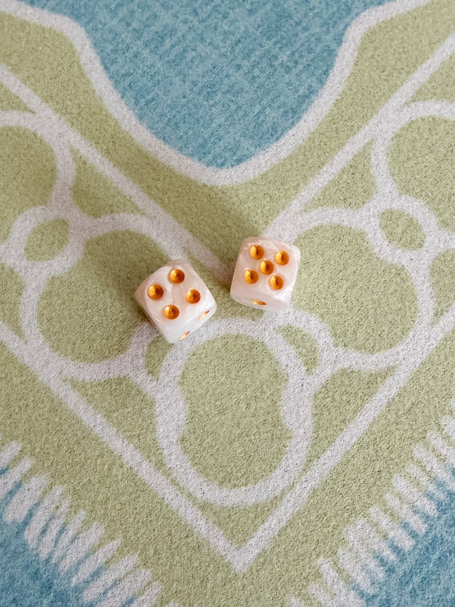 Pair of Duchess Pearlescent Mini Mahjong dice with a luminous pearlescent finish and gold pips.