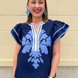 Navy embroidered flutter sleeve top with multicolor appliqué and V-neckline—lightweight and versatile for everyday wear