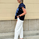 Navy embroidered flutter sleeve top with multicolor appliqué and V-neckline—lightweight and versatile for everyday wear
