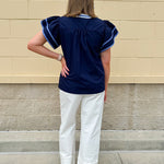 Navy embroidered flutter sleeve top with multicolor appliqué and V-neckline—lightweight and versatile for everyday wear