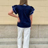 Navy embroidered flutter sleeve top with multicolor appliqué and V-neckline—lightweight and versatile for everyday wear
