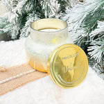 Winter white holiday candle with gold detailing