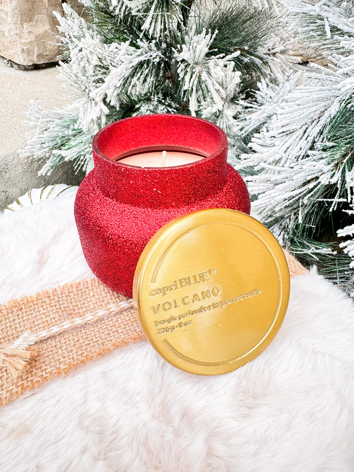 Capri Blue Red Glam Volcano 8oz candle with red glitter jar and gold lid.