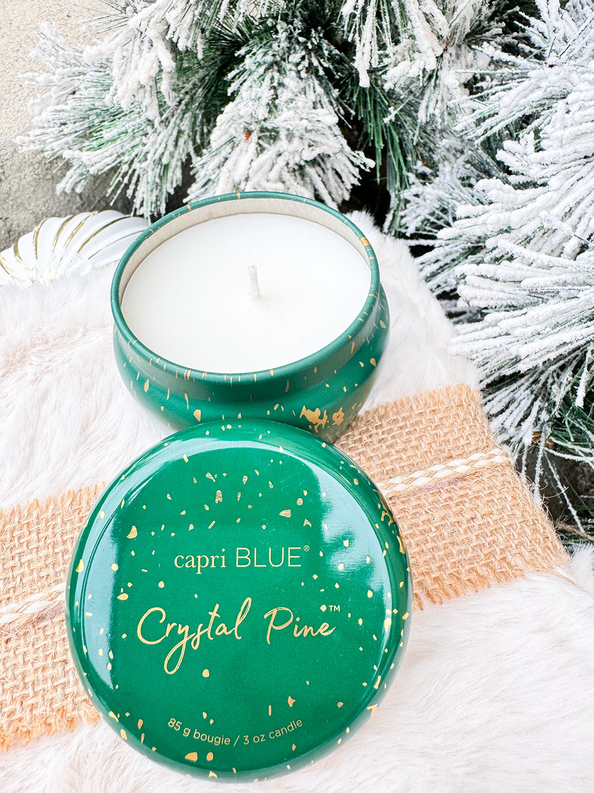 Capri Blue Crystal Pine 3oz mini tin candle in green and gold fleck design.