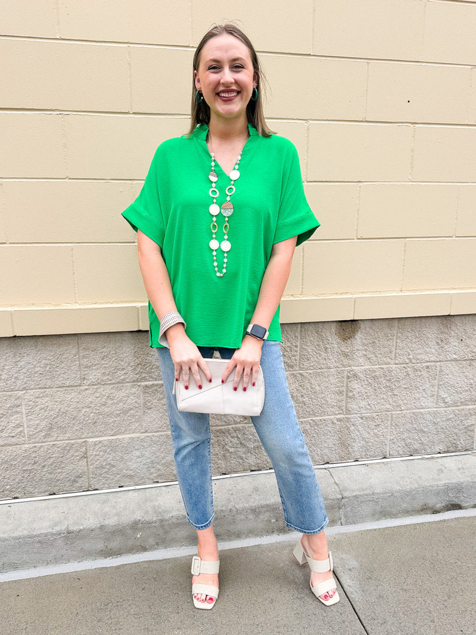 Kelly green blouse with frilled V-neckline, short dolman sleeves, and banded cuffs—bright, stylish, and feminine.