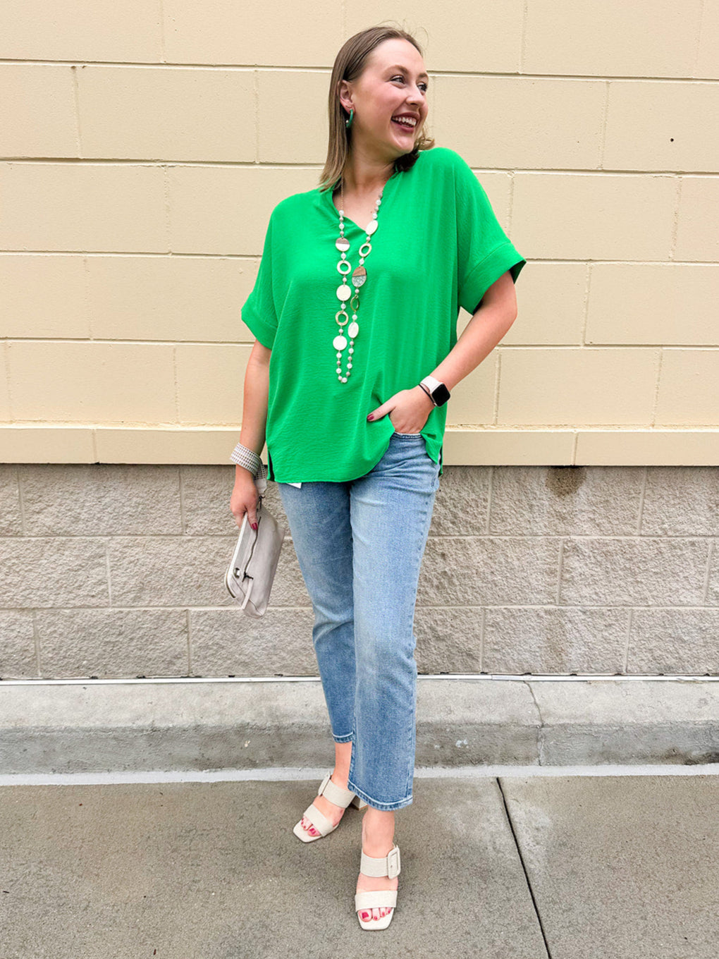 Kelly green blouse with frilled V-neckline, short dolman sleeves, and banded cuffs—bright, stylish, and feminine.