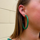 Kelly green acrylic hoop earrings with 2-inch diameter—lightweight and bold statement accessory