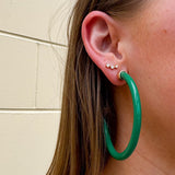 Kelly green acrylic hoop earrings with 2-inch diameter—lightweight and bold statement accessory