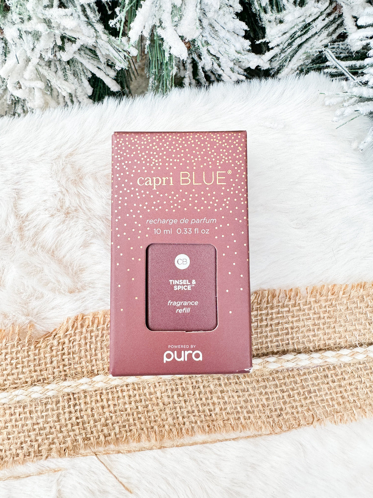 Capri Blue Tinsel & Spice Pura Diffuser Refill bottle with red and gold label.