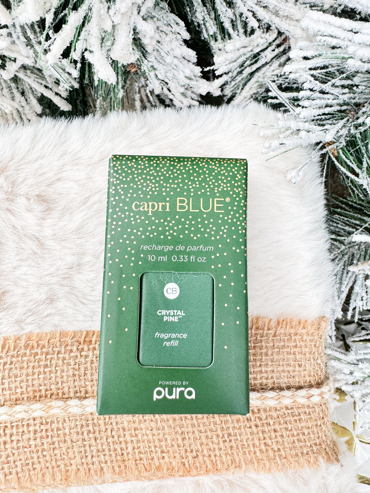 Capri Blue Crystal Pine Pura Diffuser Refill bottle with green and gold label.