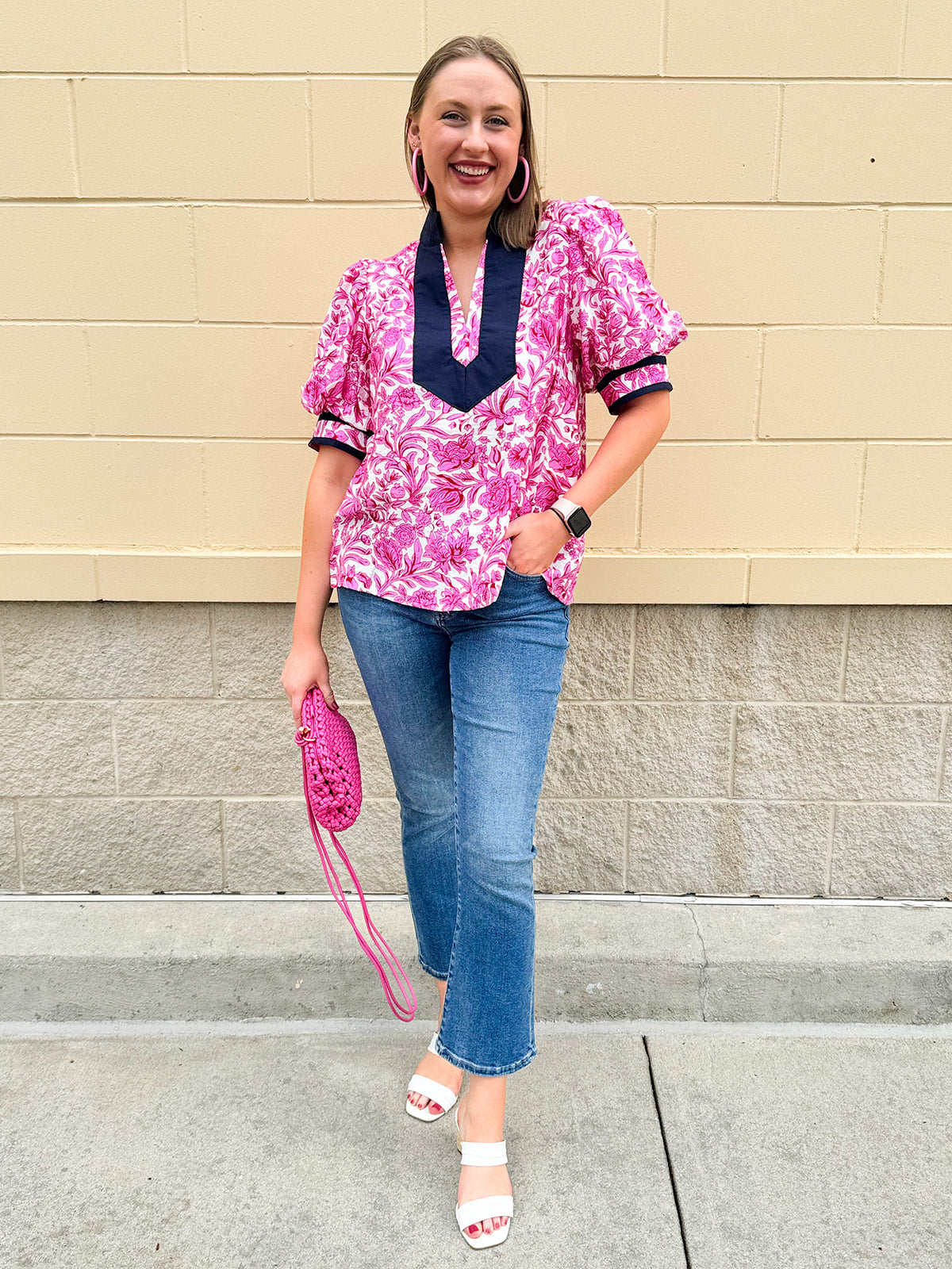 Pink caftan-style top with split neckline and botanical floral print, lightweight and relaxed fit