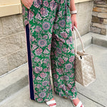 Floral paisley wide-leg pull-on pants in green and pink with contrast side stripe and elastic waist—lightweight and breezy fit