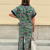 Floral paisley wide-leg pull-on pants in green and pink with contrast side stripe and elastic waist—lightweight and breezy fit