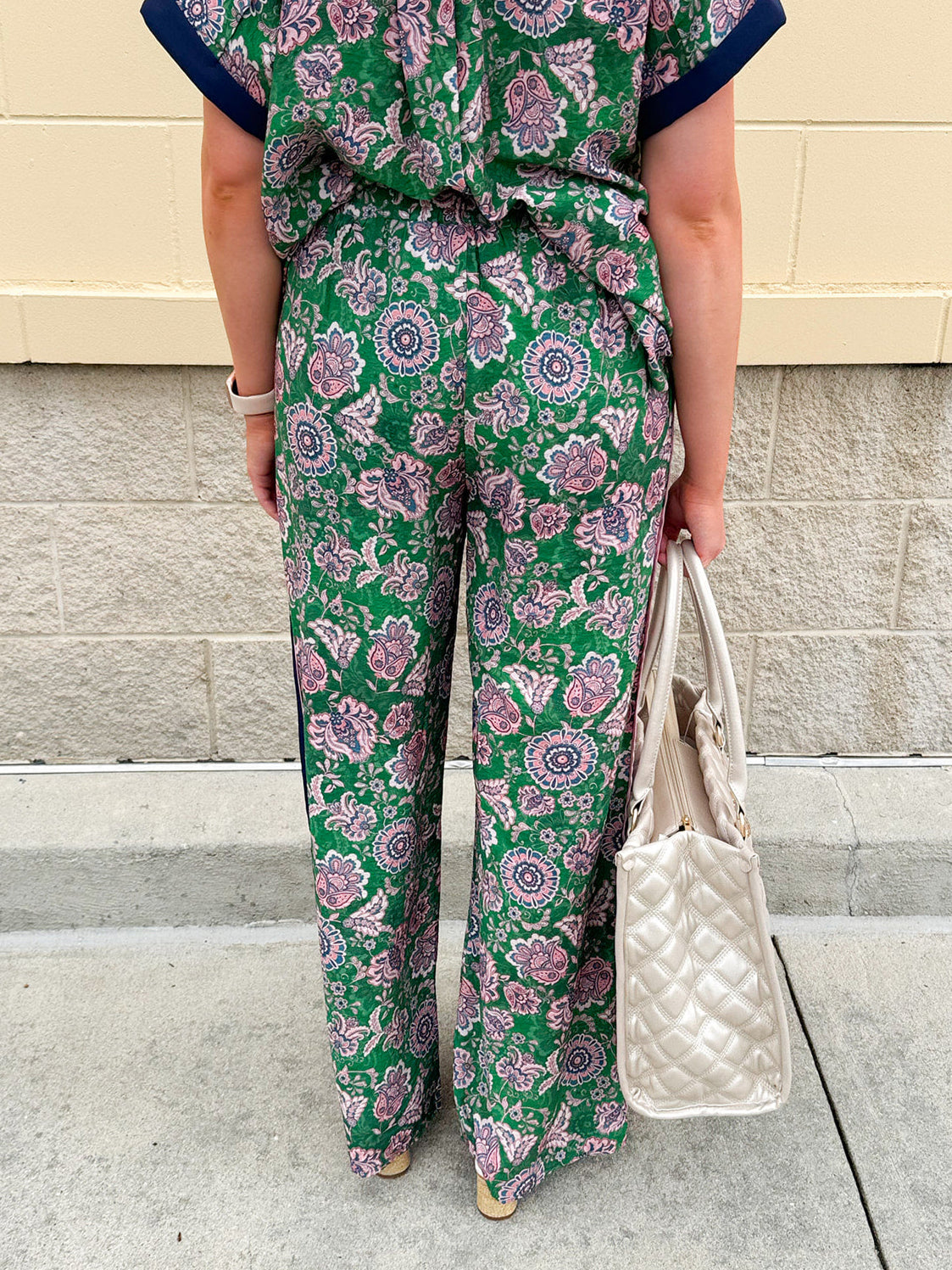 Floral paisley wide-leg pull-on pants in green and pink with contrast side stripe and elastic waist—lightweight and breezy fit