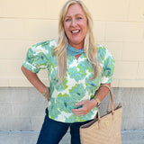 Neutral floral puff sleeve top with v-neck and blue and green print