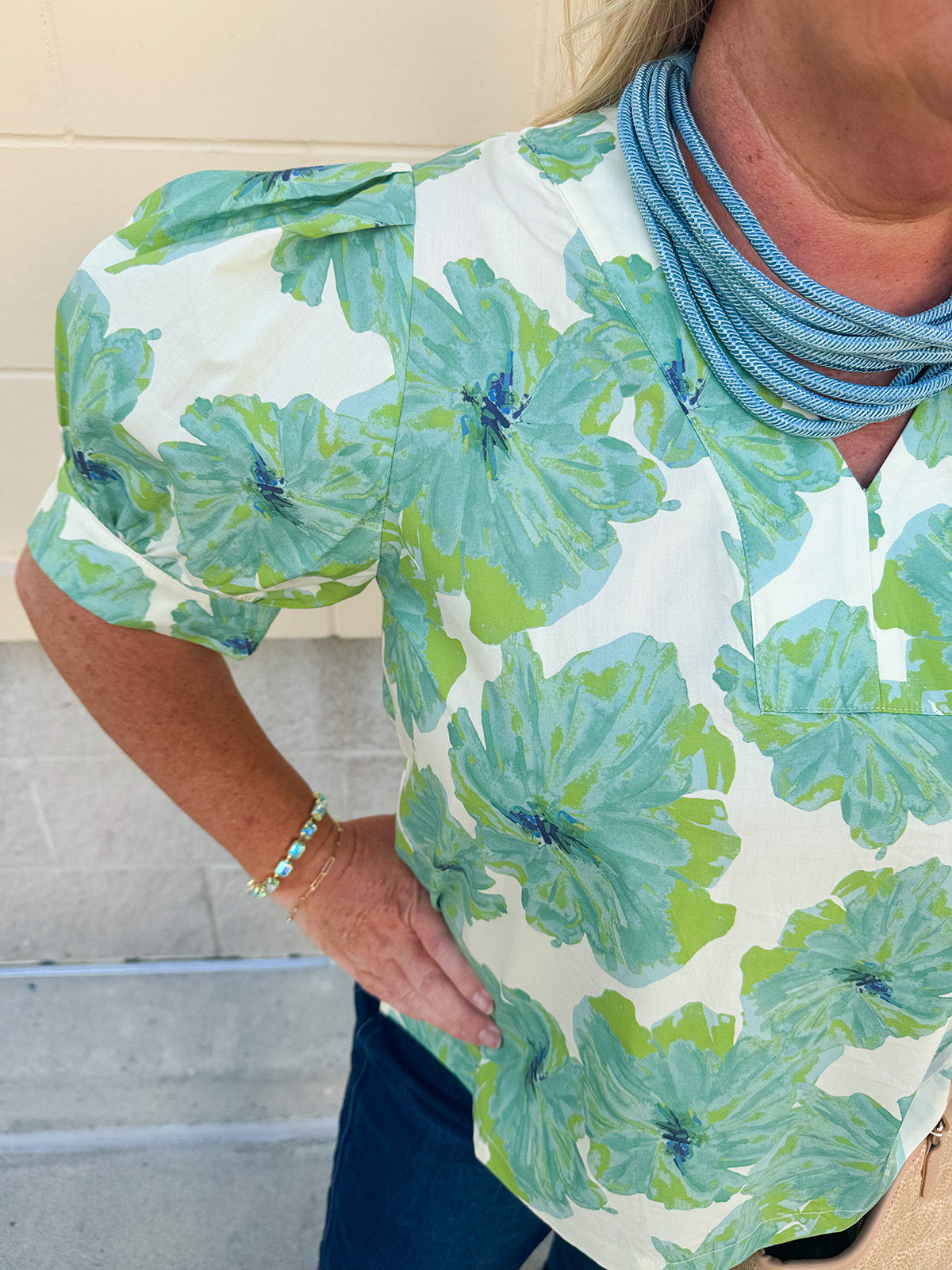 Neutral floral puff sleeve top with v-neck and blue and green print