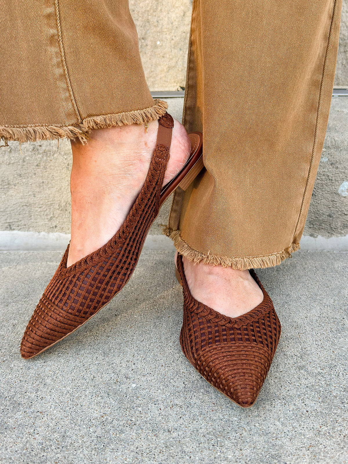 Coffee brown crochet knit slingback flats with pointed toe and leather sole.