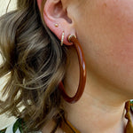 Café brown 2” acrylic hoop earrings with lightweight, hypoallergenic design.