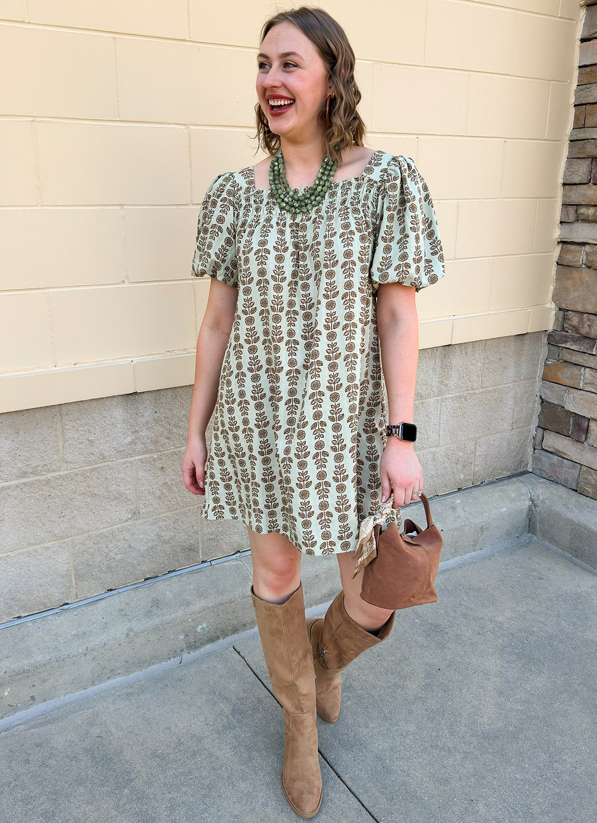 Light olive smocked mini dress with tonal floral print, puff sleeves, and square neckline