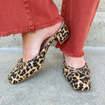 Tan leopard mule with square toe, bow accent, and low block heel.