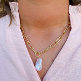 Bright gold-tone paperclip chain necklace with baroque freshwater pearl pendant from Sorrelli’s Modern Pearl Collection.