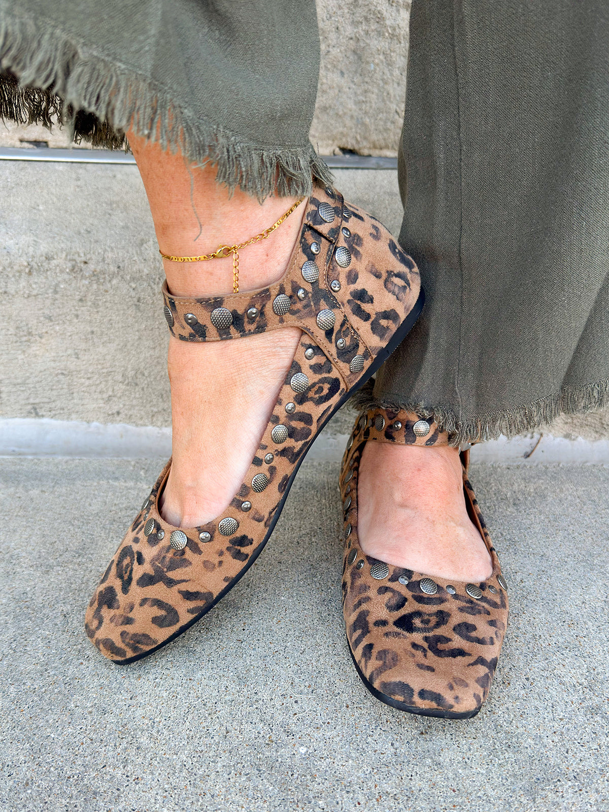 Tan leopard-print studded ankle strap ballerina flats with silver grommets and square toe.
