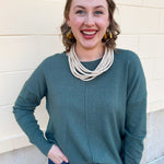 Sage green round neck knit sweater with front seam detail