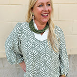 Sage and cream boho leaf print top with 3/4 sleeves, standing collar, lace trim, and solid contrast detail.
