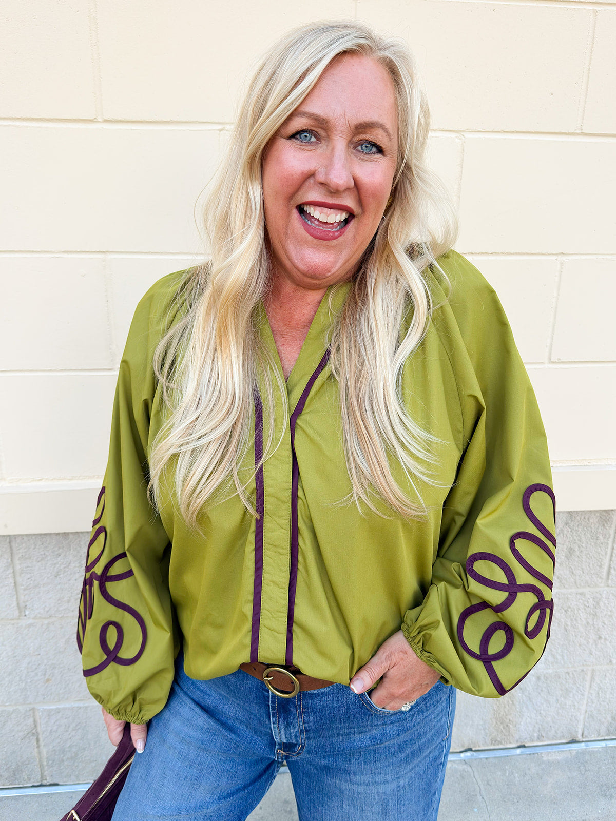 Chartreuse blouse with garnet soutache embroidery, V-neckline, and pirate-style long sleeves with elastic cuffs.