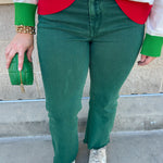 Emerald green high-waisted bootcut pants with a subtle flare and frayed hem.