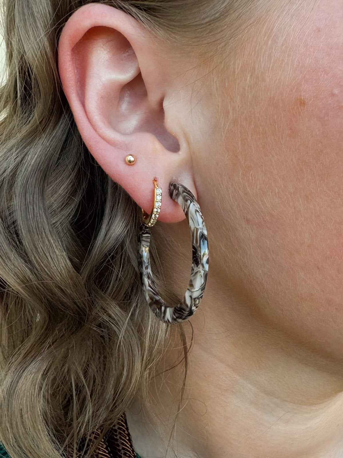 Brown and cream marbled acrylic 1.5” hoop earrings with stainless steel posts.