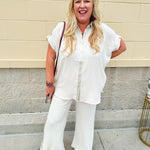 Oatmeal wide leg pants with gold side piping and drawstring waist