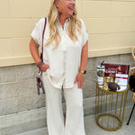 Oatmeal wide leg pants with gold side piping and drawstring waist
