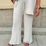 Oatmeal wide leg pants with gold side piping and drawstring waist